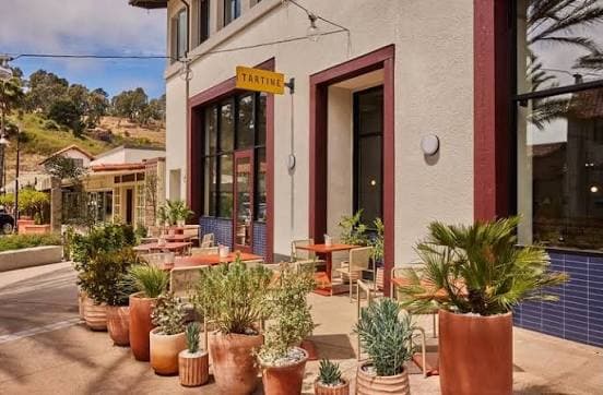 Tartine patio in Mill Valley, yellow blade sign
