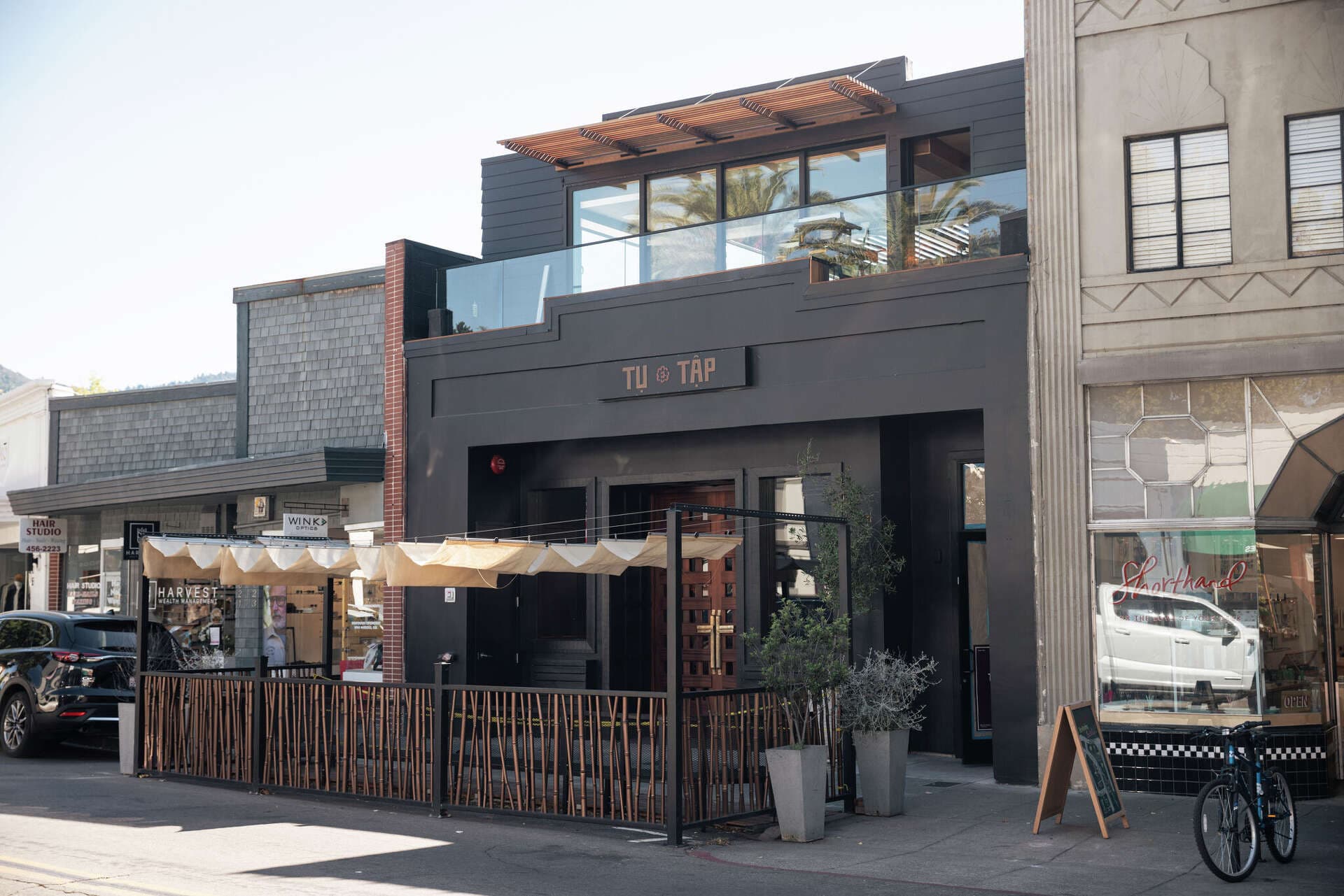 Tụ Tập storefront on San Anselmo Avenue, black facade and gold sign