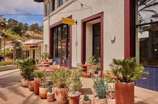Tartine patio in Mill Valley, yellow blade sign